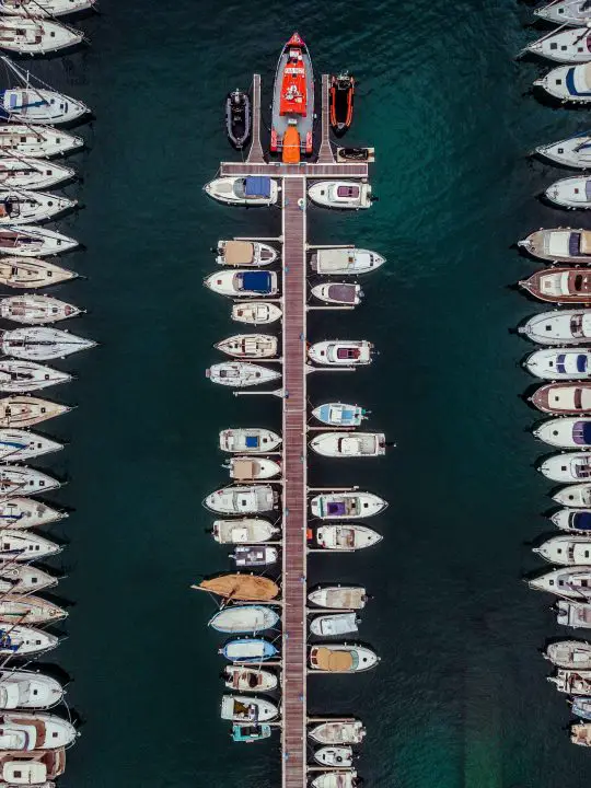 parked boats on water