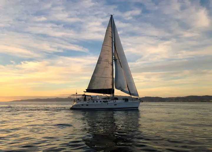 white sail boat on sea during daytime