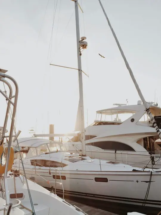 white yacht on dock during daytime