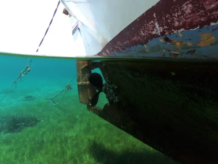 Removing barnacles from a boat bottom